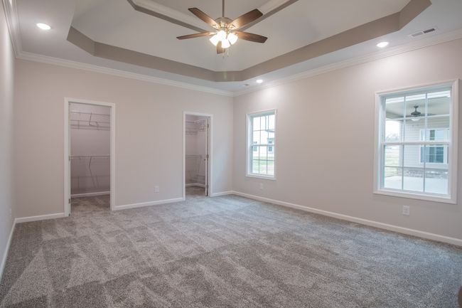 EXAMPLE>>>Amazing Primary Suite is Located on the Main Level & Features 2 Walk-in Closets, Double Tray Ceiling & Recessed Lighting! | Image 10