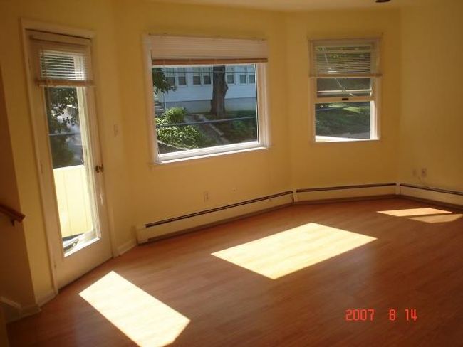2nd Fl Empty room with light hardwood / wood-style flooring and a healthy amount of sunlight | Image 6