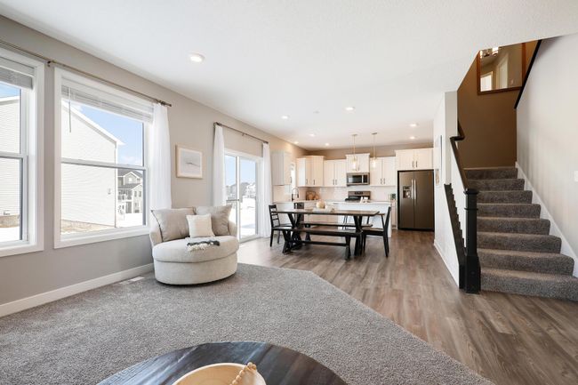 Great room with shiplap corner fireplace | Image 23