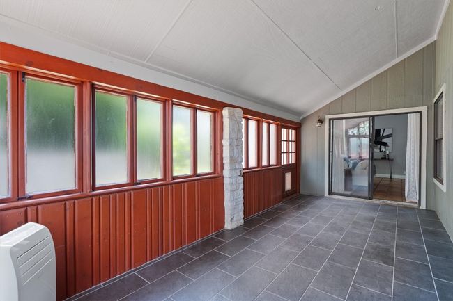 Unfurnished sunroom featuring lofted ceiling | Image 20