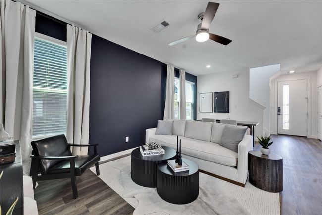 Living room featuring recessed lighting, wood finished floors, a ceiling fan, visible vents, and baseboards | Image 5