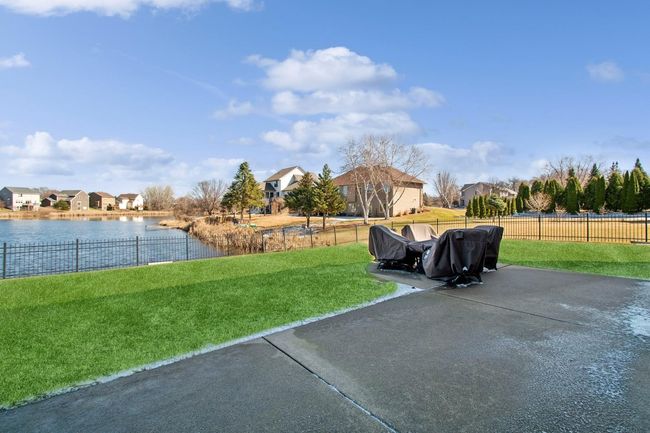 Concrete patio with lots of seating area | Image 38