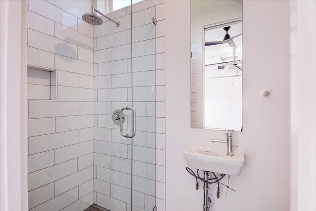 Full bathroom in the garage / flex space has everything you need -- there is also a larger sink in the cabinetry just outside of the bathroom. | Image 33