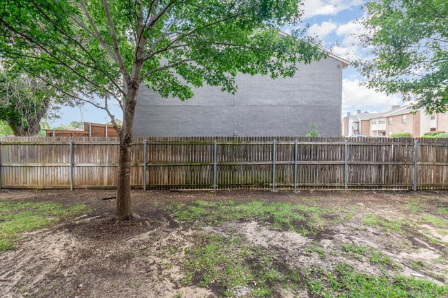 View of fenced backyard | Image 23