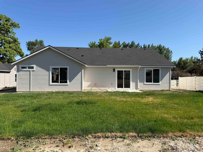 Back of property with a shingled roof | Image 13