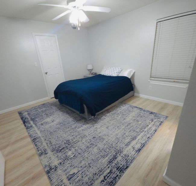 Bedroom 2 with wood finished floors and ceiling fan | Image 19