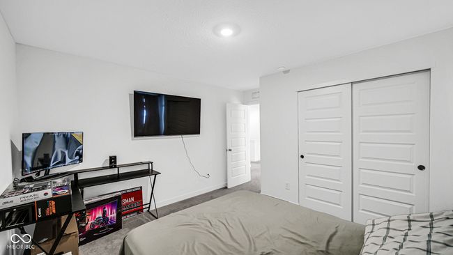 carpeted bedroom with baseboards and a closet | Image 28