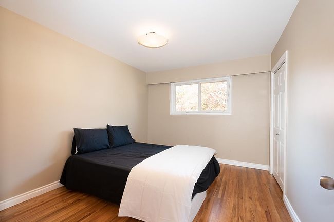 Bedroom featuring wood finished floors | Image 18