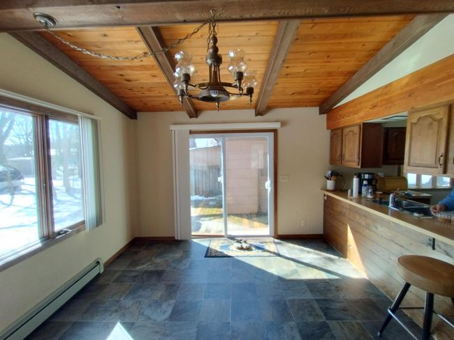 Patio door to backyard deck area and backyard | Image 10