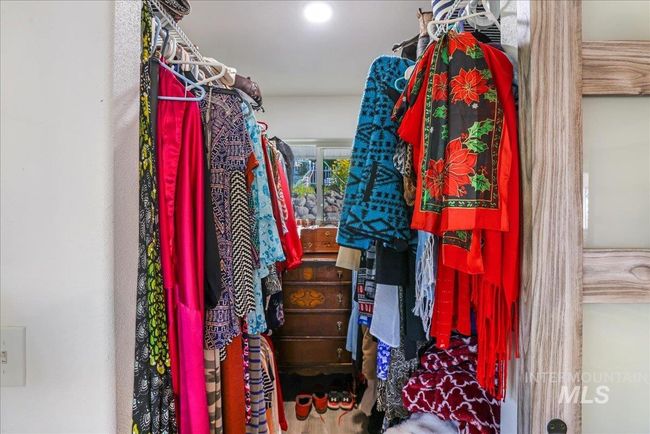 Walk-in closet with window. | Image 21