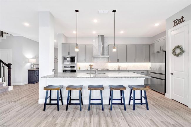 Upgraded modern vented hood and pendant lighting | Image 21