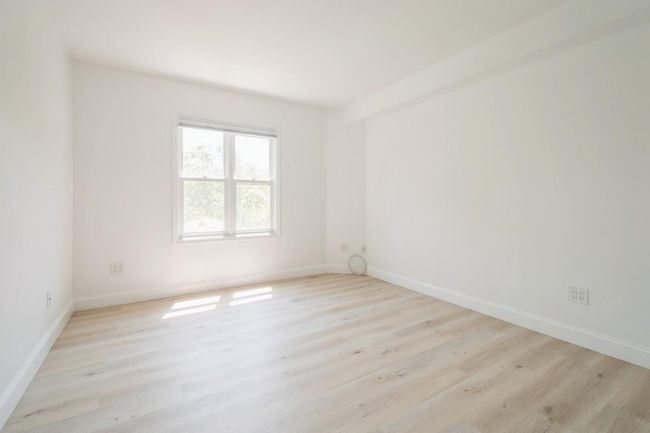 Spare room with light wood-style floors and baseboards | Image 14