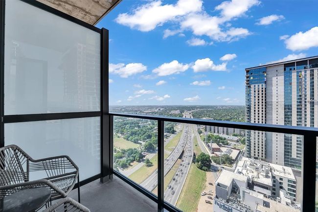 Balcony featuring a view of city | Image 16