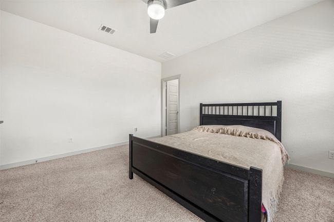 A different angle of the bedroom, showcasing the neutral color palette that makes it easy to personalize the space, and the generous size of the room. | Image 15