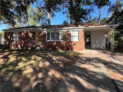 Ranch-style home featuring a carport | Image 2