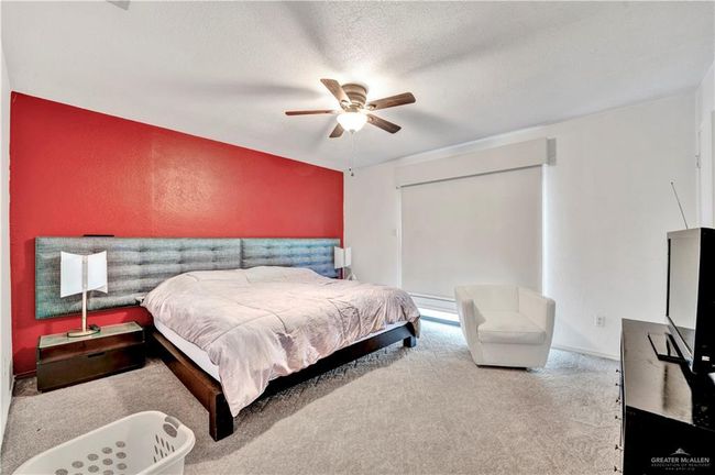 Carpeted bedroom featuring ceiling fan | Image 9