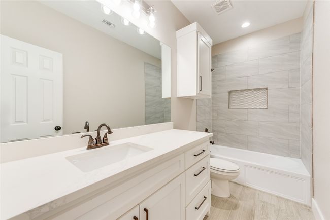 Full bathroom featuring vanity, shower / washtub combination, and recessed lighting | Image 22