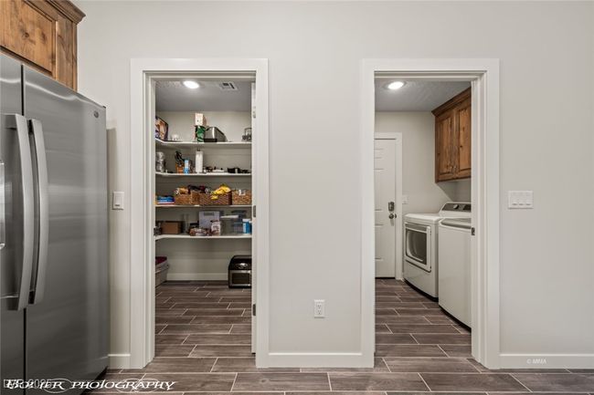 Storage area with washer and clothes dryer | Image 33