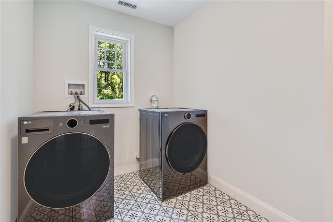 Unfurnished bedroom with carpet flooring, a ceiling fan, a walk in closet, and baseboards | Image 31