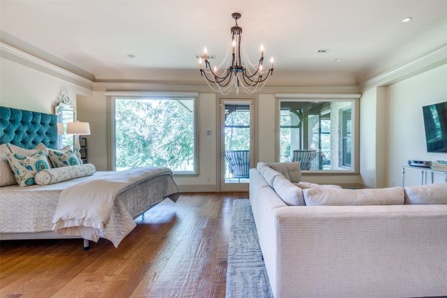 Primary Bedroom offers elevated views of trees and golf course | Image 19