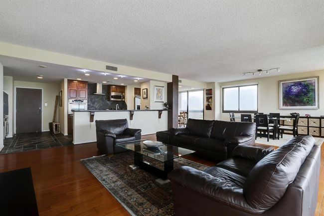 Another view of the living room looking toward the kitchen. | Image 4