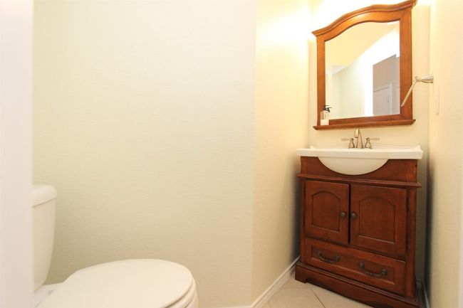 Bathroom with vanity and tile patterned floors | Image 10
