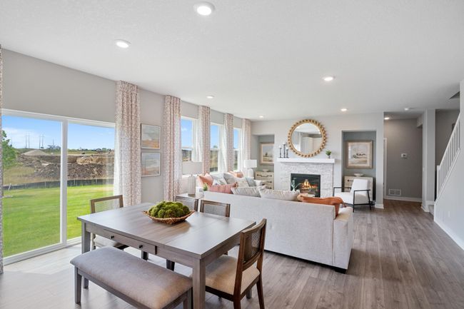 Open concept main floor with welcoming dinette. Model photo. Options and colors will vary. | Image 6