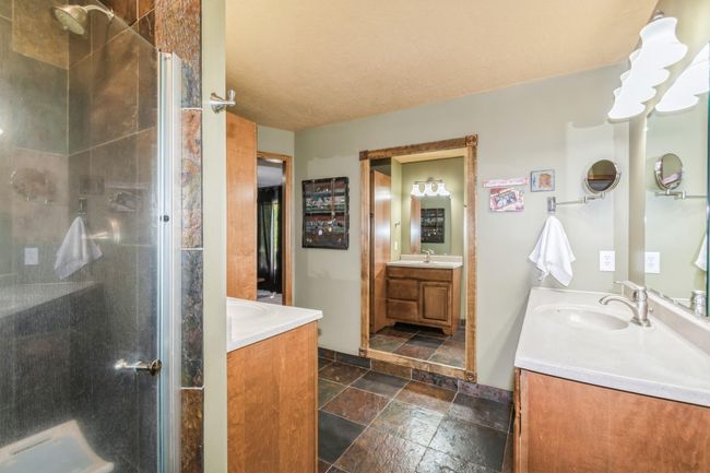Private primary bathroom has dual sinks, 3/4 shower and tiled flooring! | Image 33