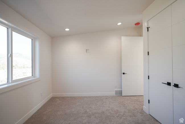 Carpeted spare room featuring recessed lighting and baseboards | Image 17