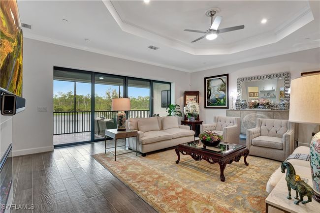 Expansive space overlooking lanai, wide lake and preserves | Image 11