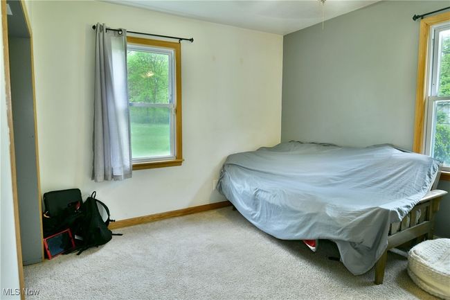 Carpeted bedroom with baseboards | Image 29