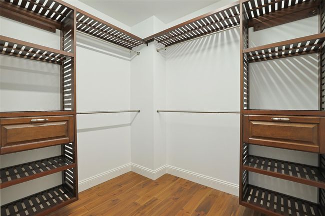 Spacious walk-in closet with closet system in place. | Image 24