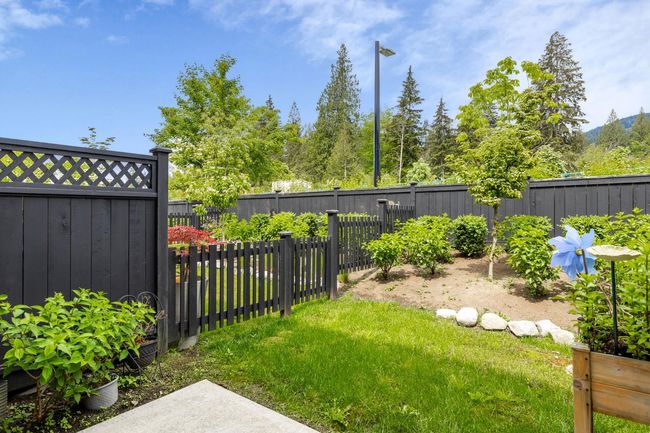 View of fenced backyard | Image 23