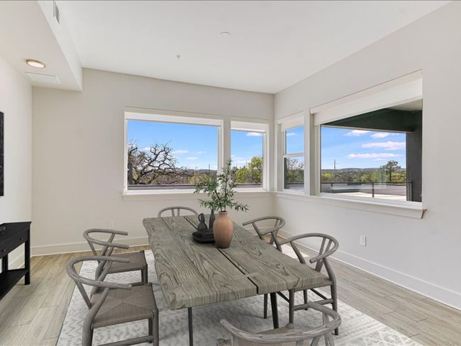 Dining room with baseboards and light wood finished floors | Image 26