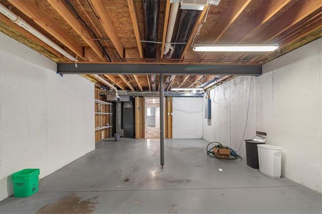Unfinished basement featuring electric panel | Image 46