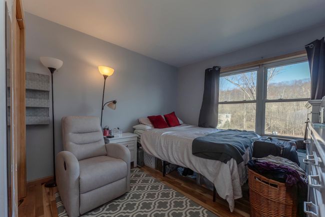 Bedroom with wood finished floors | Image 19