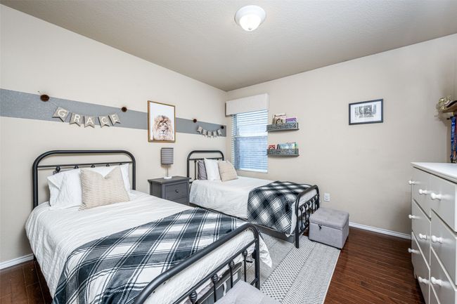Bedroom with hardwood / wood-style flooring and baseboards | Image 20