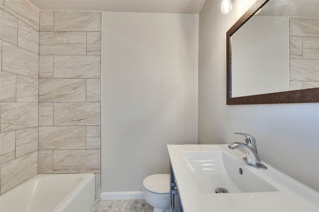 Primary Bathroom attached to primary bedroom with updated shower, light fixtures and vanity. | Image 21