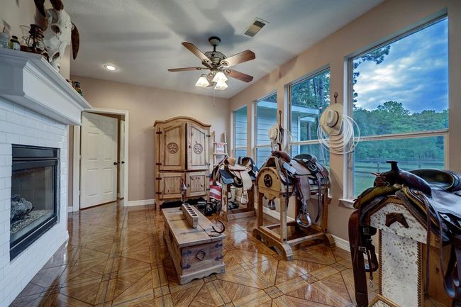 Fantastic sunroom with fireplace overlooing pastures and barn | Image 7