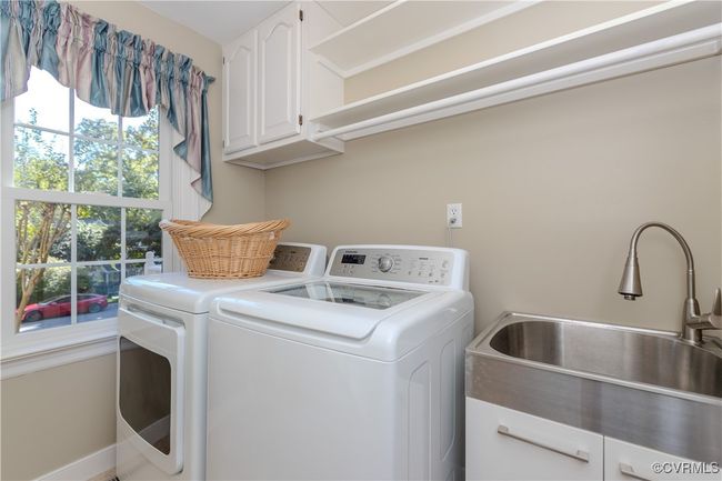 Located near garage and kitchen on first floor | Image 17