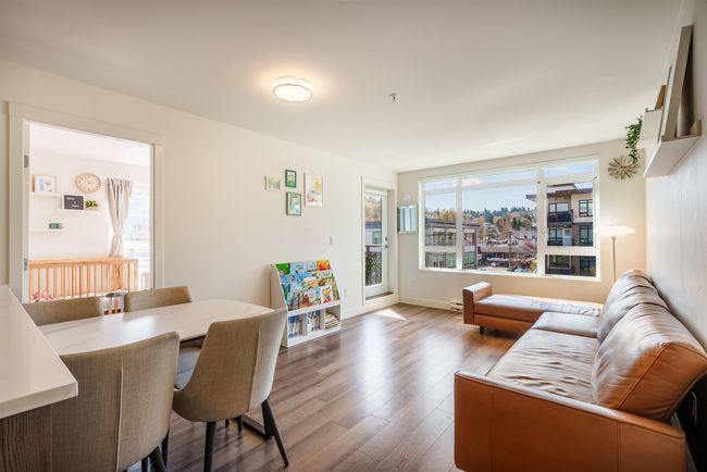 Dining area with wood finished floors and baseboards | Image 4