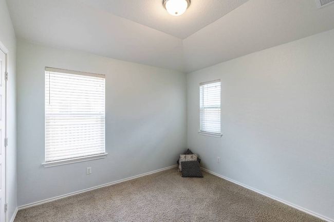 Spare room with carpet flooring and lofted ceiling | Image 14
