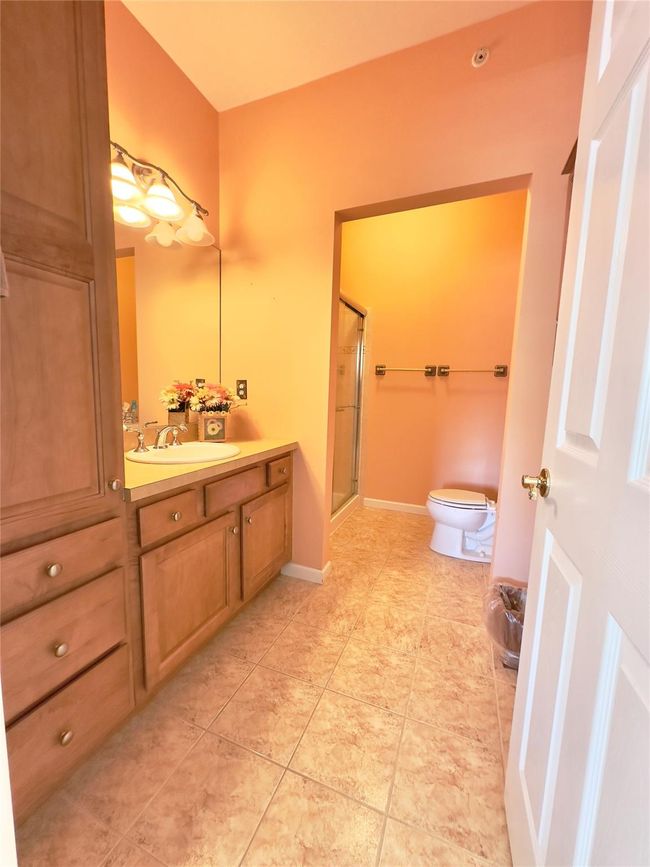 Primary Bathroom with tile patterned flooring, vanity, and a shower stall | Image 8
