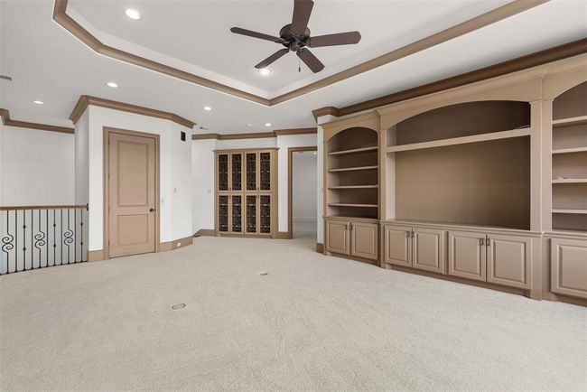 Expansive living area is adjacent to the primary suite and is a great place to unwind before retiring for the evening. | Image 28