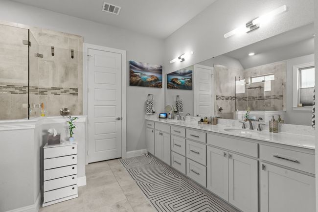 Full bath with double vanity and a tile shower | Image 17