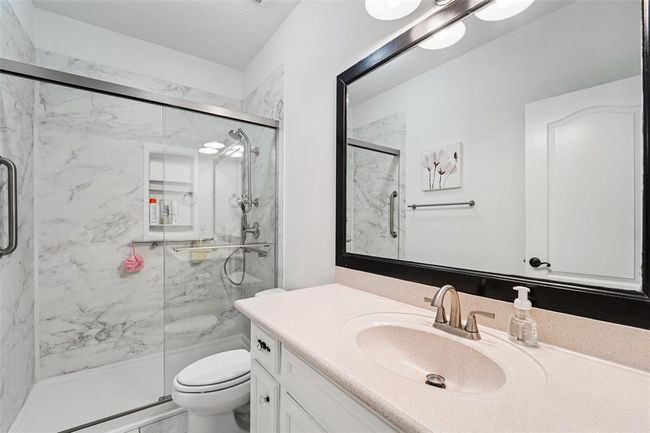 Ensuite bathroom for the 1st floor secondary bedroom was remodeled in 2023 to add a walk-in shower. | Image 26