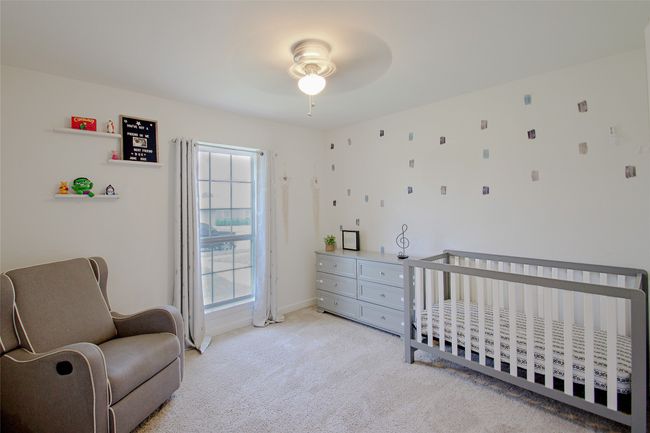 Bedroom with light carpet and baseboards | Image 23
