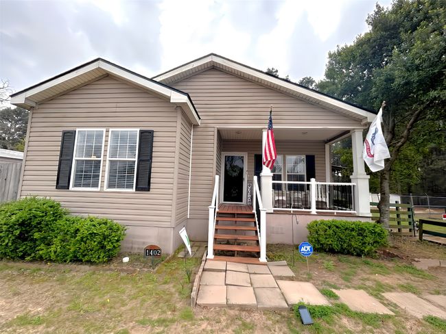 Bungalow-style home featuring covered porch | Image 6