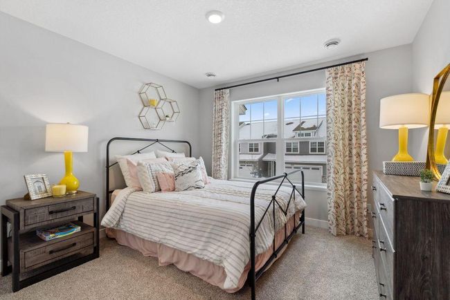 The second bedroom is spacious and perfect for guests, an office, den or hobby room! Photo of a similar layout model home, layout and colors will vary. | Image 7