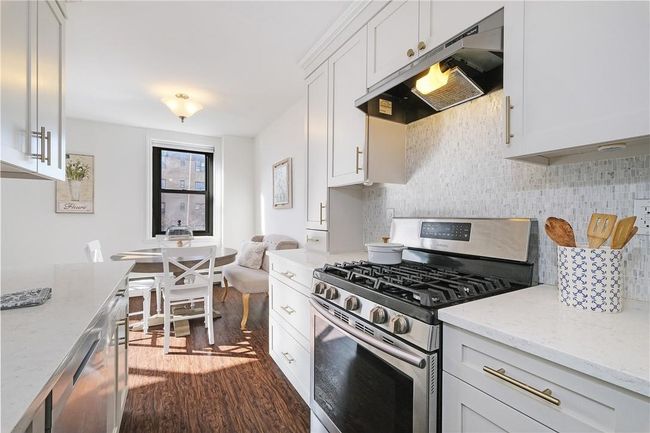 Close-up view of stove side of kitchen. | Image 22